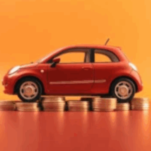 reduction-couts-flotte-electrique.webp Petite voiture rouge posée sur des pièces de monnaie représentant la réduction des coûts liés au passage à une flotte électrique.