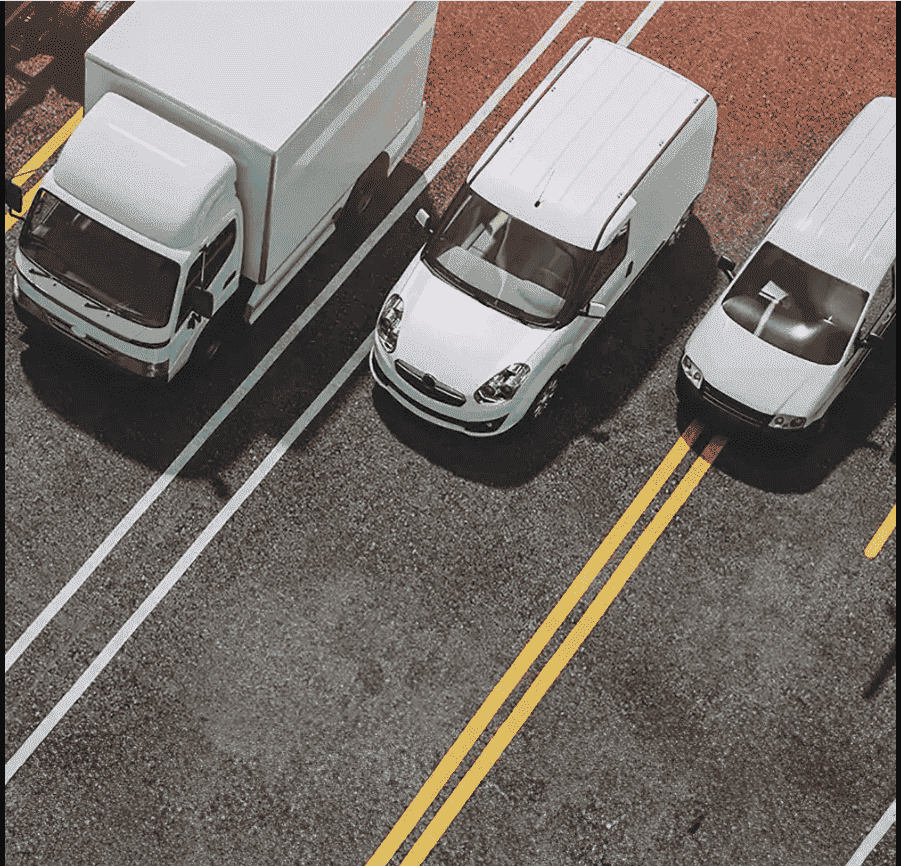 Vue aérienne de véhicules utilitaires illustrant la gestion de flotte automobile et le car fleet management en entreprise.